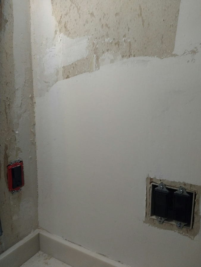 Bathroom wall partly mudded